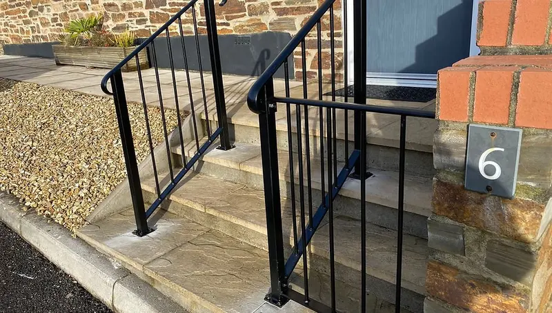 Restored black powder coated railings on front steps Mid Cornwall Powder Coating Cornwall