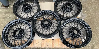 Wire wheels finished in gloss black powder coat Mid Cornwall Powder Coating