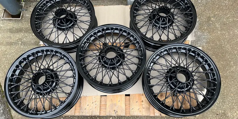 Set of five wire wheels powder coated gloss black Mid Cornwall Powder Coating Bodmin